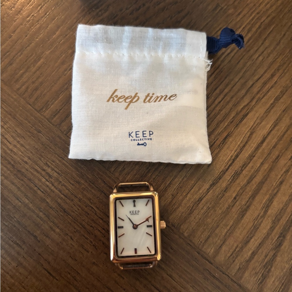 Gold and White Keep Collective Watch face